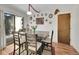 Cozy dining area with wood table and chairs, access to backyard at 1323 S Sable Blvd, Aurora, CO 80012