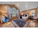 Main bedroom with vaulted ceiling, large window, and sitting area at 107 Fairfield Ln, Louisville, CO 80027