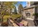 Outdoor patio with a fireplace and comfortable seating area at 107 Fairfield Ln, Louisville, CO 80027