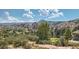 Scenic aerial view of golf course and mountain range at 8866 Waterleaf Ln, Littleton, CO 80125