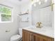 Modern bathroom with updated vanity and gold fixtures at 5775 Biscay St, Denver, CO 80249