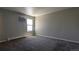 Well-lit bedroom with neutral walls and carpet flooring at 10150 E Virginia Ave # 308, Denver, CO 80247