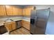 Kitchen with stainless steel appliances and wood cabinets at 10150 E Virginia Ave # 308, Denver, CO 80247