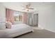 Light and airy bedroom with a queen bed and ceiling fan at 18636 E 45Th Pl, Denver, CO 80249