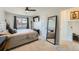 Bedroom with a full-size bed and large mirror at 17899 E Princeton Pl, Aurora, CO 80013