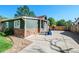 Green house with stone accents and a spacious driveway at 624 Stuart St, Denver, CO 80204