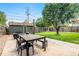 Spacious backyard with a patio, lawn, and detached garage at 624 Stuart St, Denver, CO 80204