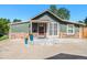 Charming ranch home with stone accents and landscaped yard at 624 Stuart St, Denver, CO 80204