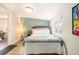 Bright bedroom with a queen-size bed and a window offering natural light at 624 Stuart St, Denver, CO 80204