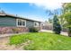 Landscaped front yard with stone accents and green grass at 624 Stuart St, Denver, CO 80204