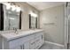 Bathroom with double vanity and a shower at 10074 Matthew Ln, Littleton, CO 80130