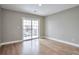 Light-filled bedroom with a sliding glass door leading to a balcony at 10074 Matthew Ln, Littleton, CO 80130