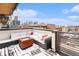 Rooftop deck with seating area, fire pit, and city views at 2438 Welton St, Denver, CO 80205