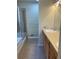 Clean bathroom with double vanity and shower/tub combo at 1266 S Ammons St, Lakewood, CO 80232