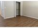 Well-lit bedroom with a closet and wood-look floors at 1266 S Ammons St, Lakewood, CO 80232