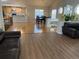 Open concept dining area adjacent to the living room and kitchen at 1266 S Ammons St, Lakewood, CO 80232