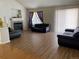 Spacious living room with hardwood floors and a fireplace at 1266 S Ammons St, Lakewood, CO 80232