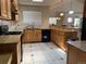 Modern kitchen with granite countertops and wood cabinets at 1266 S Ammons St, Lakewood, CO 80232