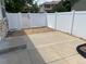 Small backyard with gravel, a white fence, and a patio at 1266 S Ammons St, Lakewood, CO 80232