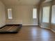 Bright bedroom featuring ample natural light and wood-look floors at 1266 S Ammons St, Lakewood, CO 80232