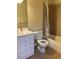 Bathroom with a shower/tub, toilet, and vanity at 1266 S Ammons St, Lakewood, CO 80232