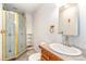 Basement bathroom with shower stall, sink, and toilet at 4901 S Wadsworth Blvd # 17, Denver, CO 80123