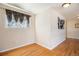 Small bedroom with hardwood floors and window coverings at 4901 S Wadsworth Blvd # 17, Denver, CO 80123