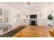 Living room features hardwood floors, fireplace, and built-in shelves at 931 S York St, Denver, CO 80209