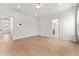 Bright bedroom with hardwood floors and access to a bathroom at 972 Arapahoe Cir, Louisville, CO 80027