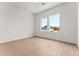 Light-filled bedroom with hardwood floors and dual windows at 972 Arapahoe Cir, Louisville, CO 80027