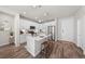 Bright and airy kitchen with white cabinets, quartz countertops, and an island at 400 E Fremont Pl # 204, Littleton, CO 80122