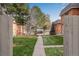 Pathway through a grassy courtyard between brick townhouses at 3669 W Union Ave, Denver, CO 80236