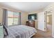 Comfortable bedroom with ample natural light and a view at 5555 Perth Ct, Denver, CO 80249