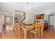 Kitchen dining area with hardwood floors and chandelier at 5555 Perth Ct, Denver, CO 80249