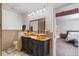 Elegant bathroom with double vanities, a large mirror, and a shower at 5555 Perth Ct, Denver, CO 80249