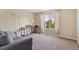 Functional home office with a desk and comfortable couch at 5555 Perth Ct, Denver, CO 80249