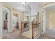 Upstairs hallway with carpet and access to bedrooms and bathroom at 5555 Perth Ct, Denver, CO 80249