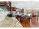 Kitchen features granite countertops and wine rack at 5555 Perth Ct, Denver, CO 80249