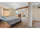 Main bedroom with carpeted floor and large window at 5555 Perth Ct, Denver, CO 80249