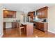 Modern kitchen with granite island and stainless steel appliances at 5555 Perth Ct, Denver, CO 80249