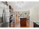 Open concept kitchen with stainless steel appliances at 5555 Perth Ct, Denver, CO 80249