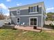 Two-story house with gray siding and backyard patio at 5555 Perth Ct, Denver, CO 80249