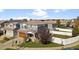 Aerial view of a two-story house with gray siding and a fenced backyard at 5555 Perth Ct, Denver, CO 80249