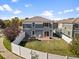 Aerial view of house showcasing backyard, patio, and fence at 5555 Perth Ct, Denver, CO 80249