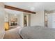Bright bedroom with large windows, TV mount, and ensuite bathroom access at 5555 Perth Ct, Denver, CO 80249