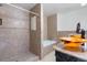 Clean bathroom with a shower, bathtub, and double sinks at 5555 Perth Ct, Denver, CO 80249