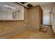 Interior of an office space featuring exposed brick walls and a staircase at 3333 Colorado Blvd, Denver, CO 80205