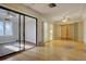 Living room with hardwood floors, sliding glass doors, and ceiling fans at 3333 Colorado Blvd, Denver, CO 80205