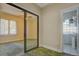 Bedroom with carpet, sliding glass doors and adjacent bathroom at 3333 Colorado Blvd, Denver, CO 80205