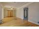 Hardwood floor living room with sliding doors leading to another room at 3333 Colorado Blvd, Denver, CO 80205
